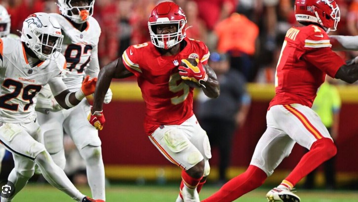 Kenneth Walker III breaks through the Denver defense for the Chiefs